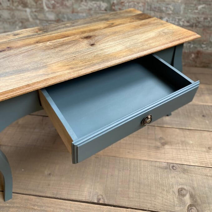 Coffee table with drawer open