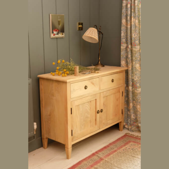 Empire sideboard for storage shown in the natural wood.