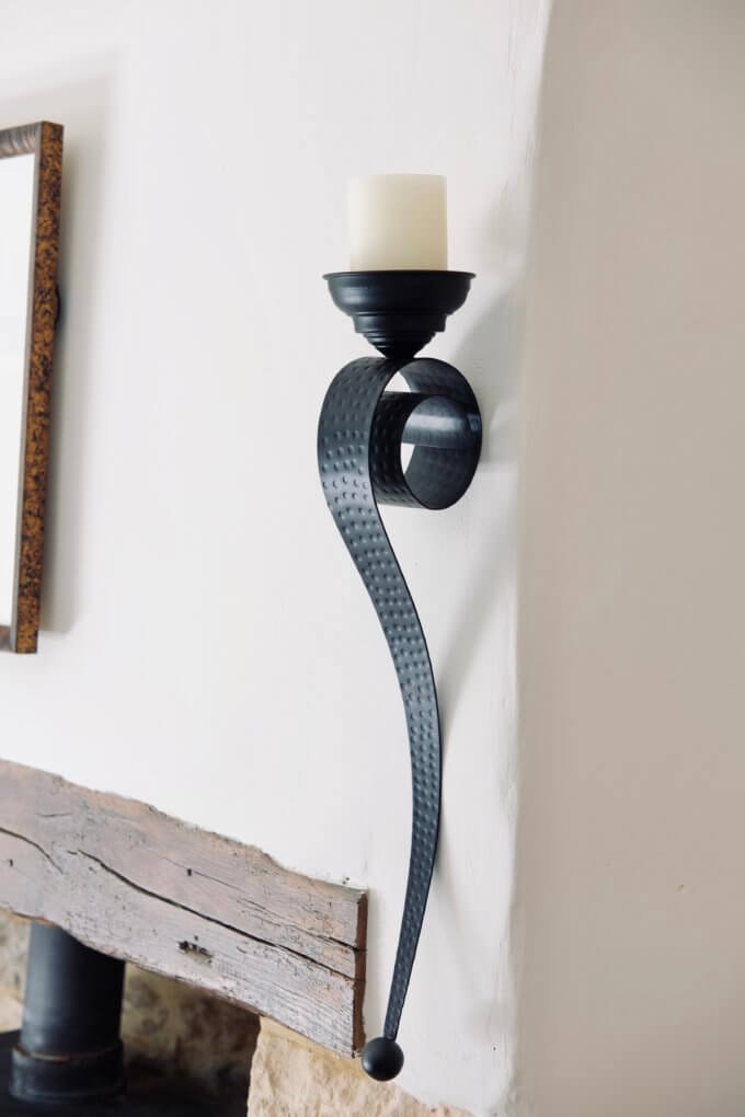 Candle holder by fireplace
